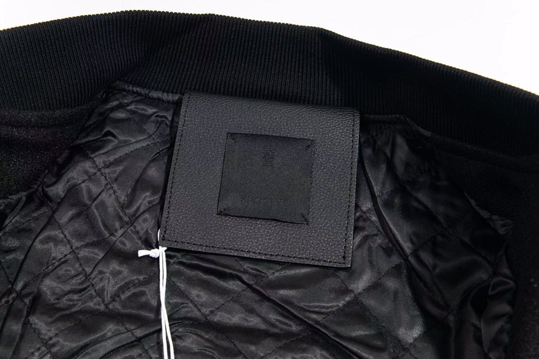 Black inner neck label on varsity jacket collar with ribbed knit trim