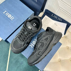 Dior unisex sneakers, dark grey pair with lace-up uppers and side emblem, angled view