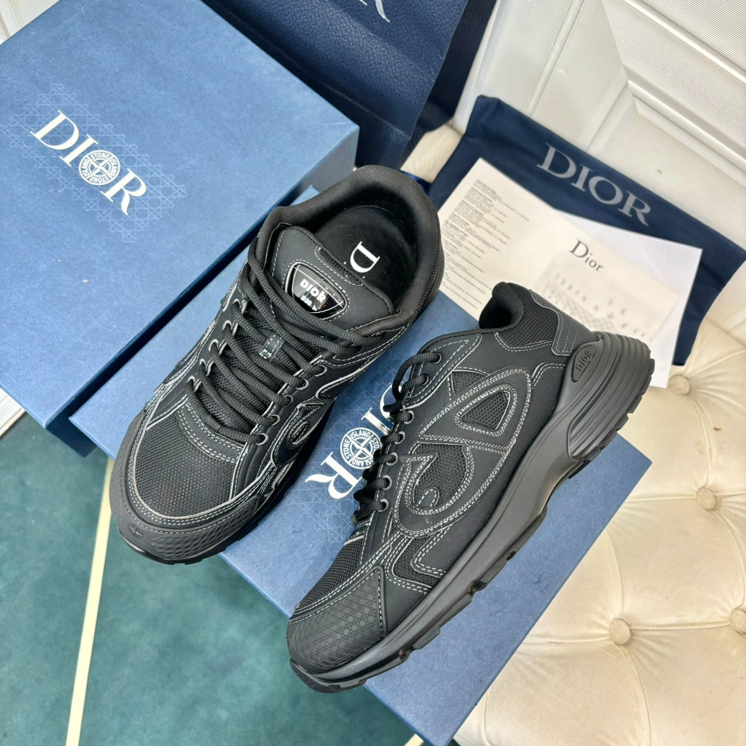 Dior unisex sneakers, dark grey pair with lace-up uppers and side emblem, angled view