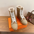Hermes unisex high-top boots with white laces and shearling collar, tan colorway.