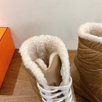 Hermes unisex boot interior view, showing white shearling lining around the collar.