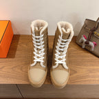 Hermes unisex high-top boots in tan with white shearling lining and lace-up front.