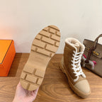 Hermes unisex high-top boot sole view with textured tread and tan boot upper.