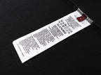Black Gucci short-sleeve T-shirt with care label tag inside collar