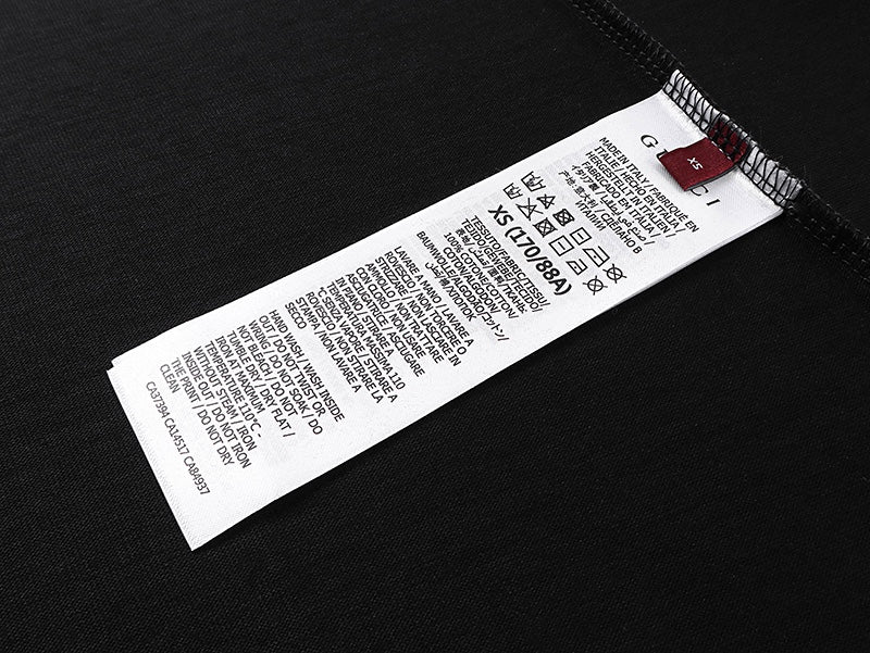 Black Gucci short-sleeve T-shirt with care label tag inside collar