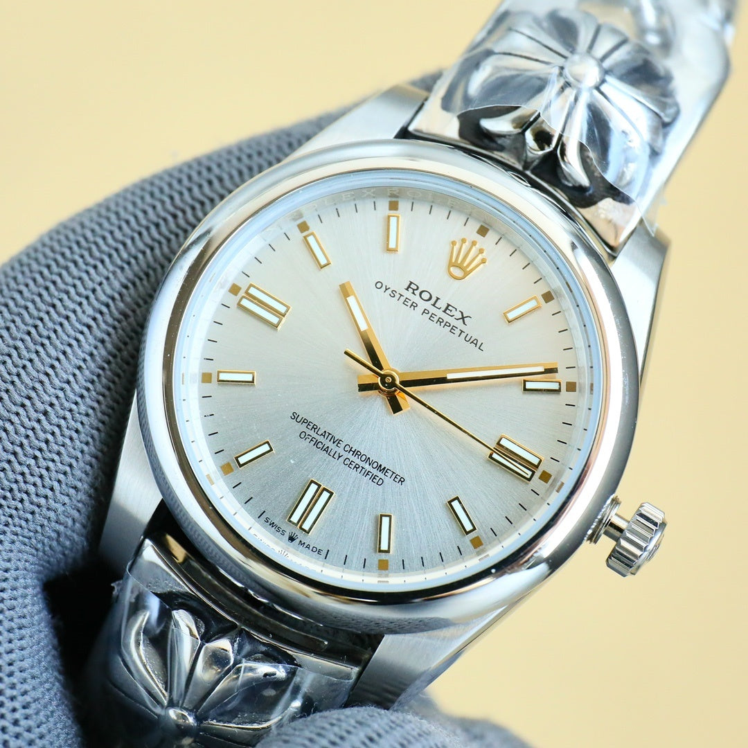 Rolex Oyster Perpetual wristwatch with champagne dial, gold hands, steel case