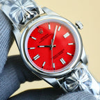Rolex Oyster Perpetual watch with red dial and silver bracelet, baton hour markers