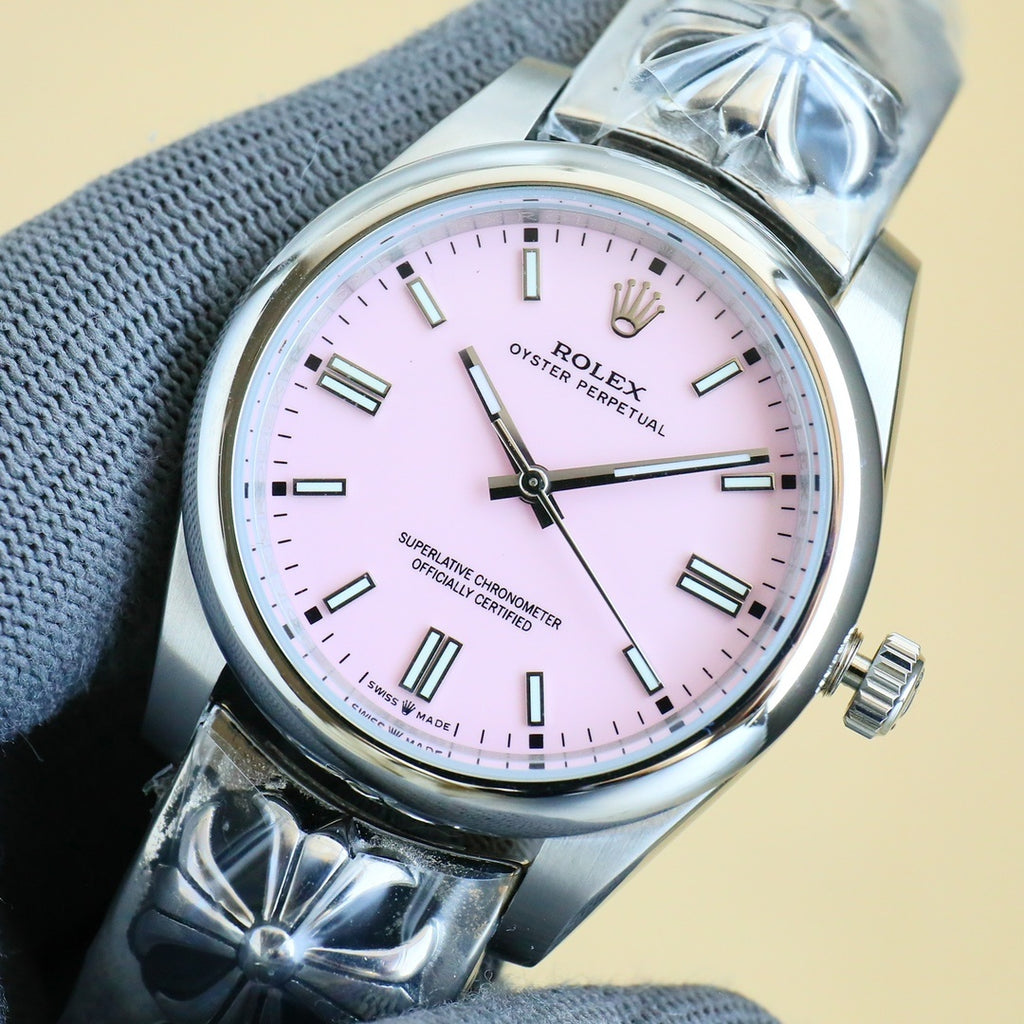 Rolex Oyster Perpetual watch with pale pink dial and silver bracelet, baton hour markers