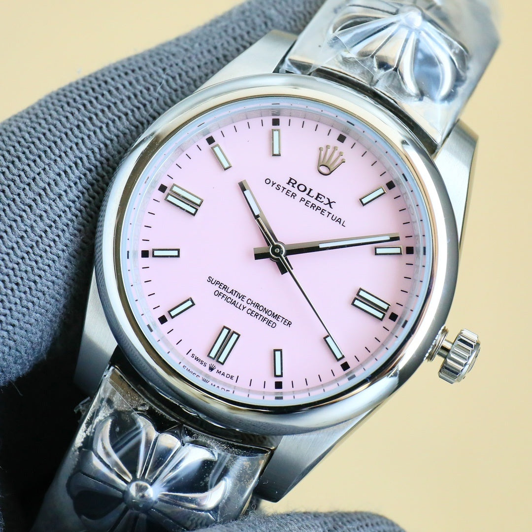 Rolex Oyster Perpetual watch with pale pink dial and silver bracelet, baton hour markers