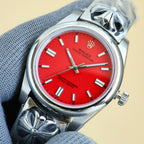 Rolex Oyster Perpetual watch with red dial, silver bracelet, crown on the right side