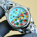 Rolex wristwatch angled view on dark fabric, turquoise dial with multicolor motifs and silver bezel
