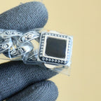 Rolex wristwatch clasp with silver engraved caseback plate and dark fabric band
