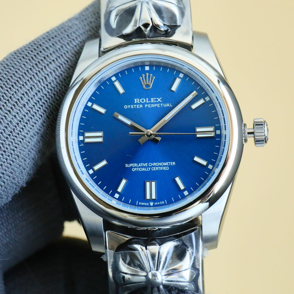Rolex wristwatch with blue dial, gold-tone markers, silver case and bracelet