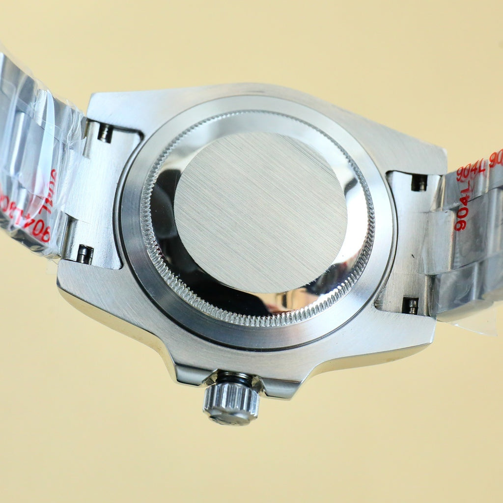 Rolex stainless steel wristwatch caseback with brushed back and crown stem opening.