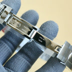 Rolex watch clasp and caseback with engraved metal surfaces and polished edges