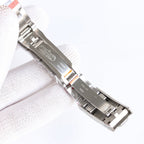 Silver metal watch bracelet and clasp, close-up view