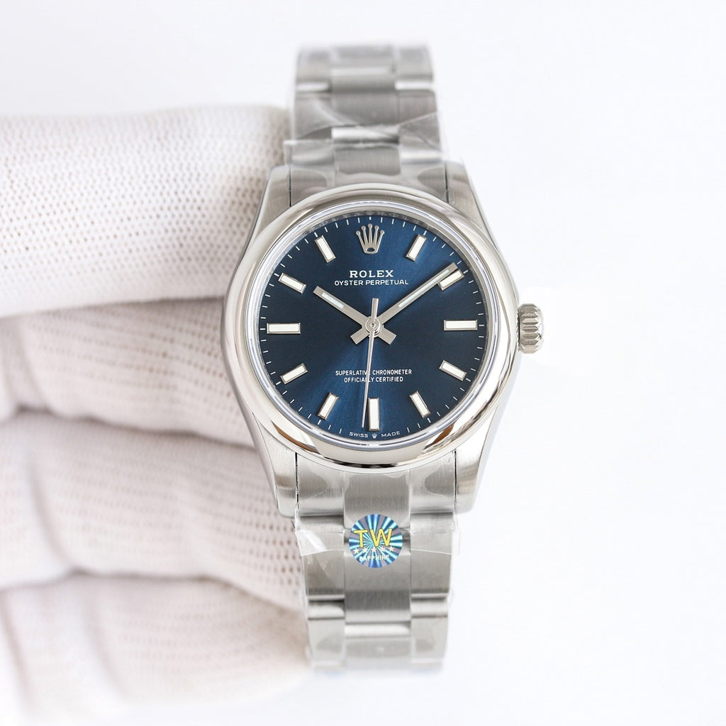 Steel wristwatch with dark blue dial and silver link bracelet, crown at side