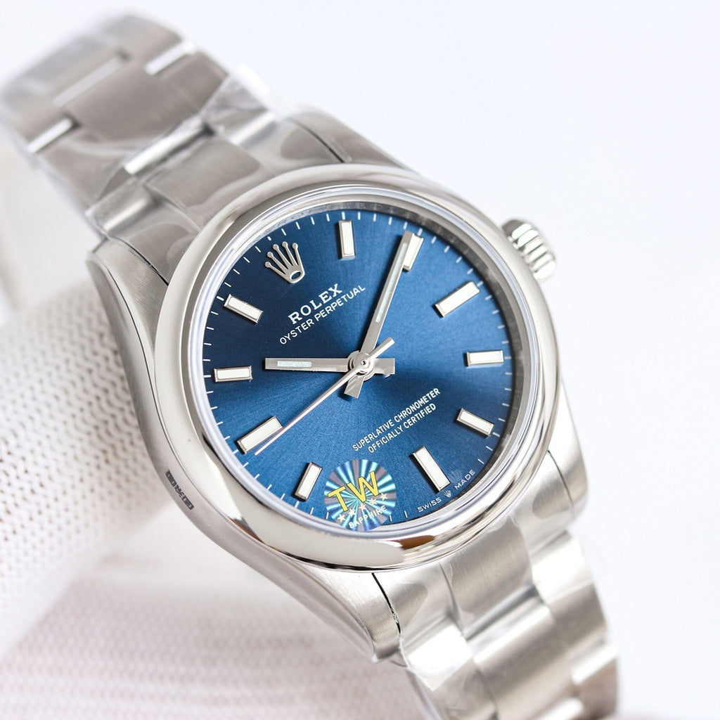 Steel wristwatch with blue dial and silver link bracelet, baton markers