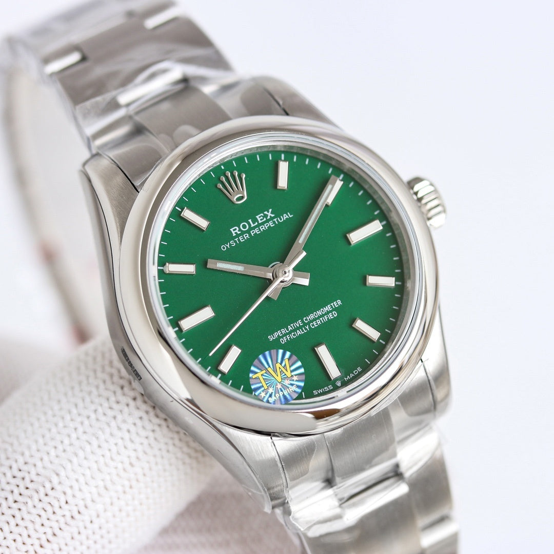 Stainless-steel wristwatch with green dial, baton hour markers, and crown at 3 o'clock