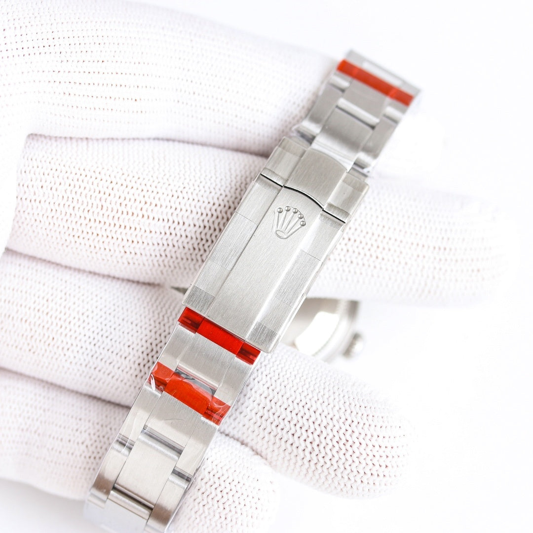 Rolex Oyster Perpetual stainless steel bracelet with clasp and red accent links