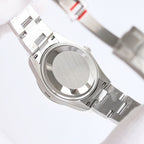 Rolex watch caseback with brushed silver finish and ridged bezel on bracelet