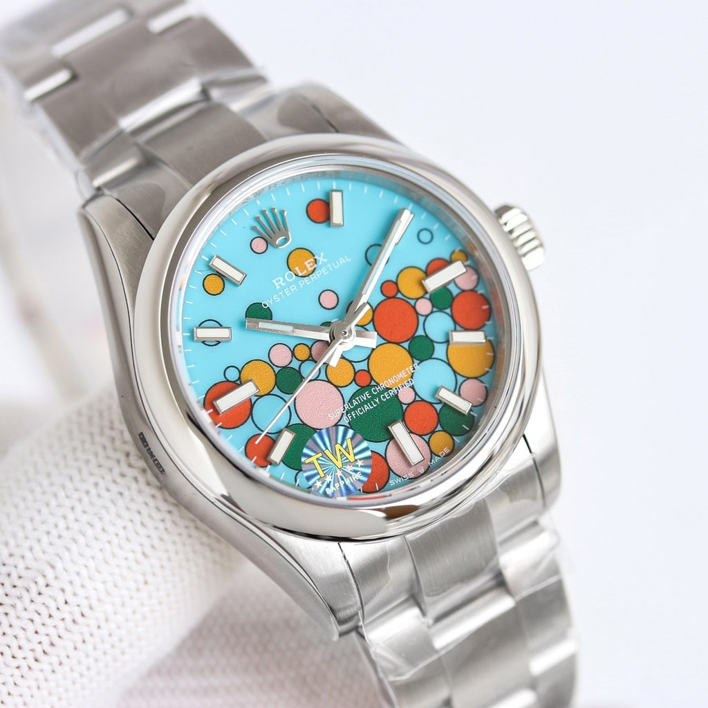 Rolex watch with turquoise pop-art dial, silver hands, and stainless steel bracelet
