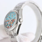 Rolex watch side profile with turquoise dial and crown on silver metal bracelet