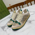 Gucci unisex sneakers with white leather, green side panels, and sparkling glitter toe
