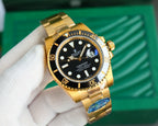 Gold-tone wristwatch with black dial, gold bezel, and metal bracelet