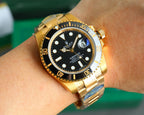 Rolex Submariner watch on wrist, black dial with blue-tinted crystal