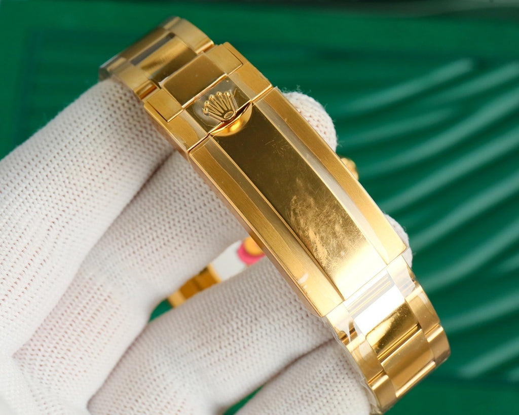 Rolex gold bracelet clasp and case side, close-up on white glove