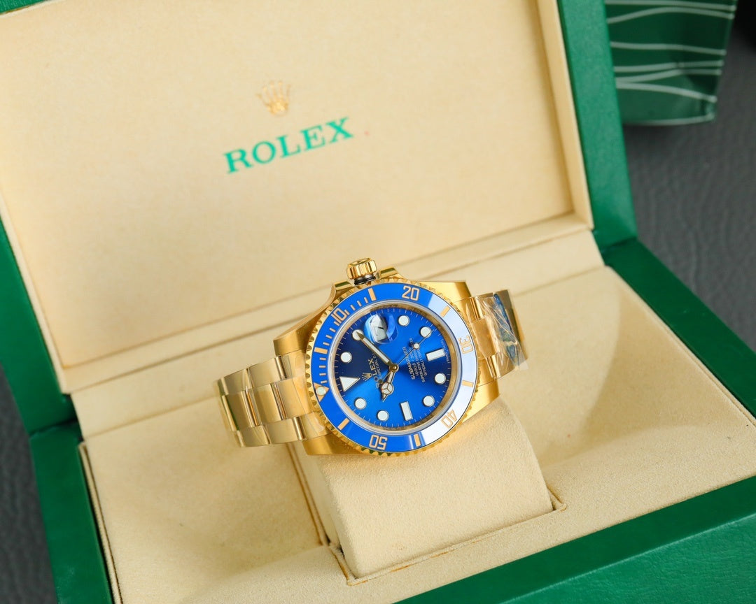 Rolex gold watch with blue dial and bracelet, in open display box