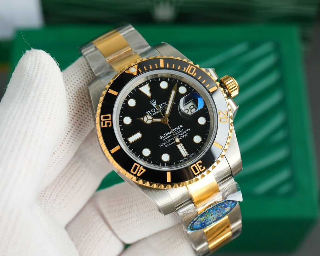 Rolex watch angled view, black dial with gold markers and date window, metal bracelet