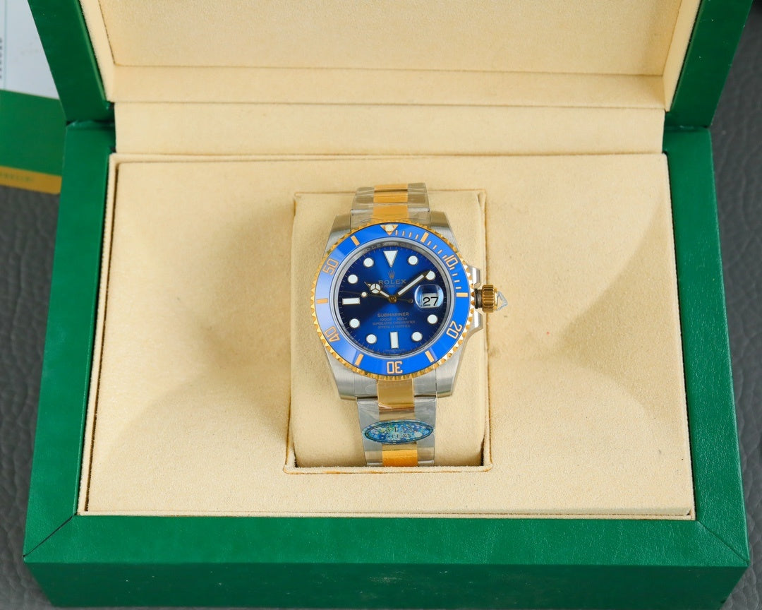 Rolex watch in display box, blue dial and gold bezel with steel-and-gold bracelet