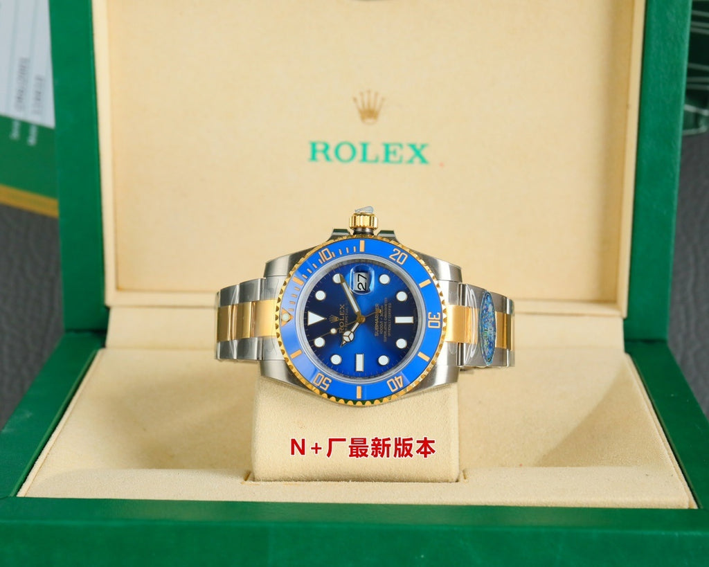 Rolex watch front on display stand, blue dial, gold bezel, steel-and-gold bracelet