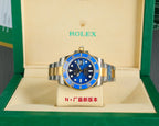 Rolex watch front on display stand, blue dial, gold bezel, steel-and-gold bracelet