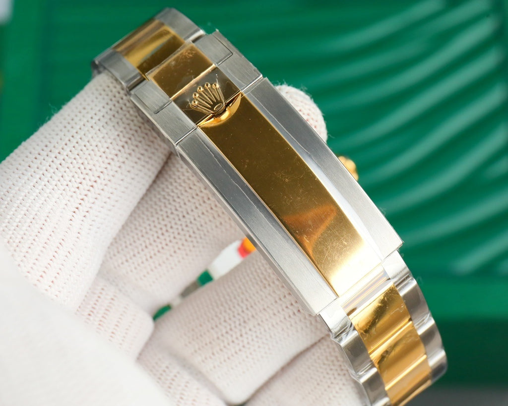 Rolex watch bracelet clasp, steel links with gold trim and gold crown logo