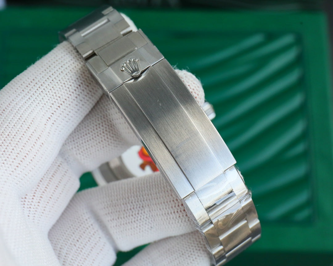 Stainless steel wristwatch bracelet with folding clasp, close-up side view