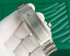 Rolex watch in stainless steel with crown detail and bracelet links, close-up view