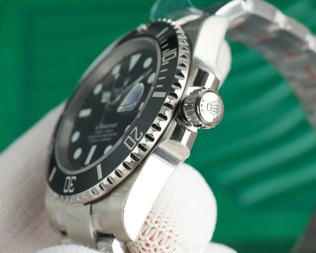 Rolex watch with black dial and stainless steel bezel, angled side view