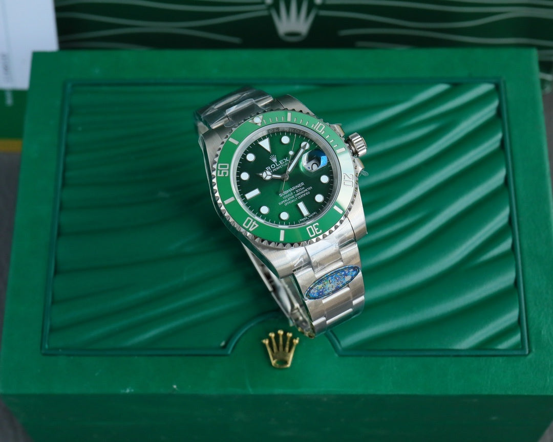 Rolex Submariner green dial stainless steel wristwatch on green presentation box