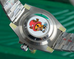 Rolex watch stainless steel caseback with colorful emblem and green bezel ring