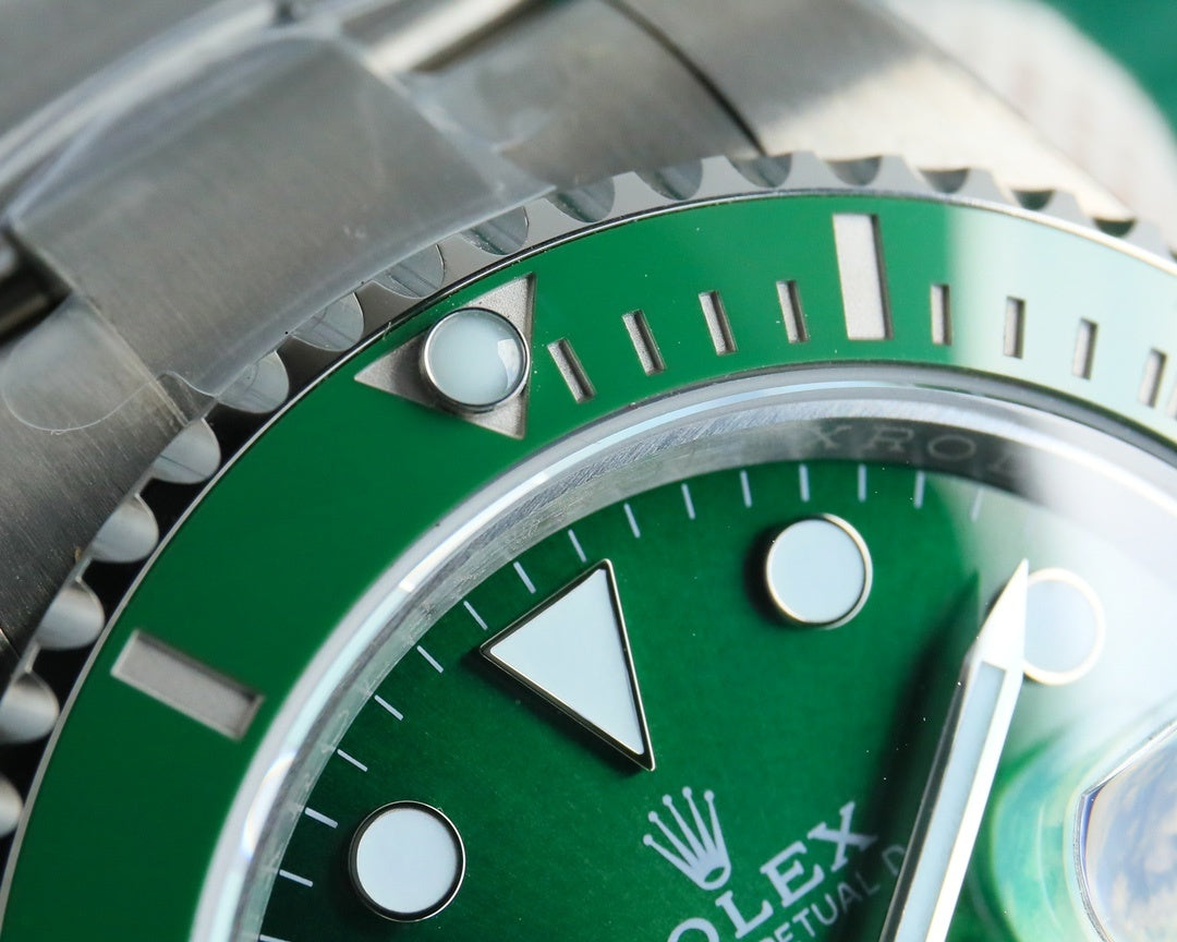 Rolex Submariner green dial close-up with index markers and triangular hour hand