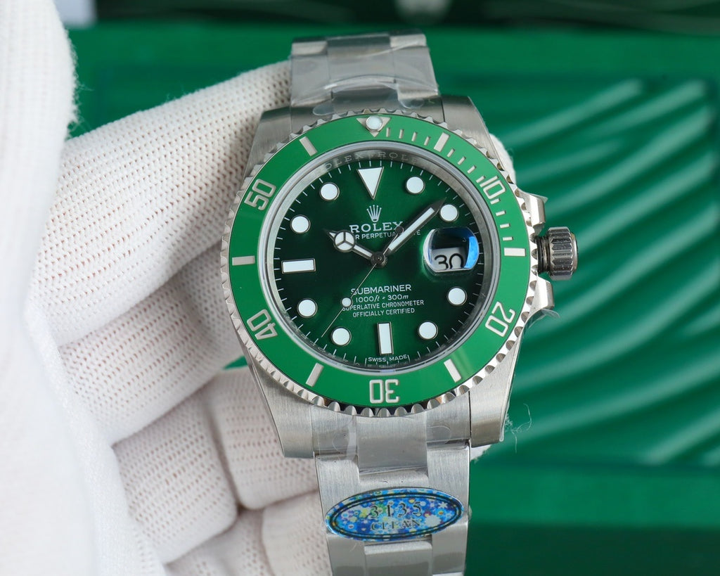Rolex Submariner green dial stainless steel wristwatch with bracelet, bezel and crown