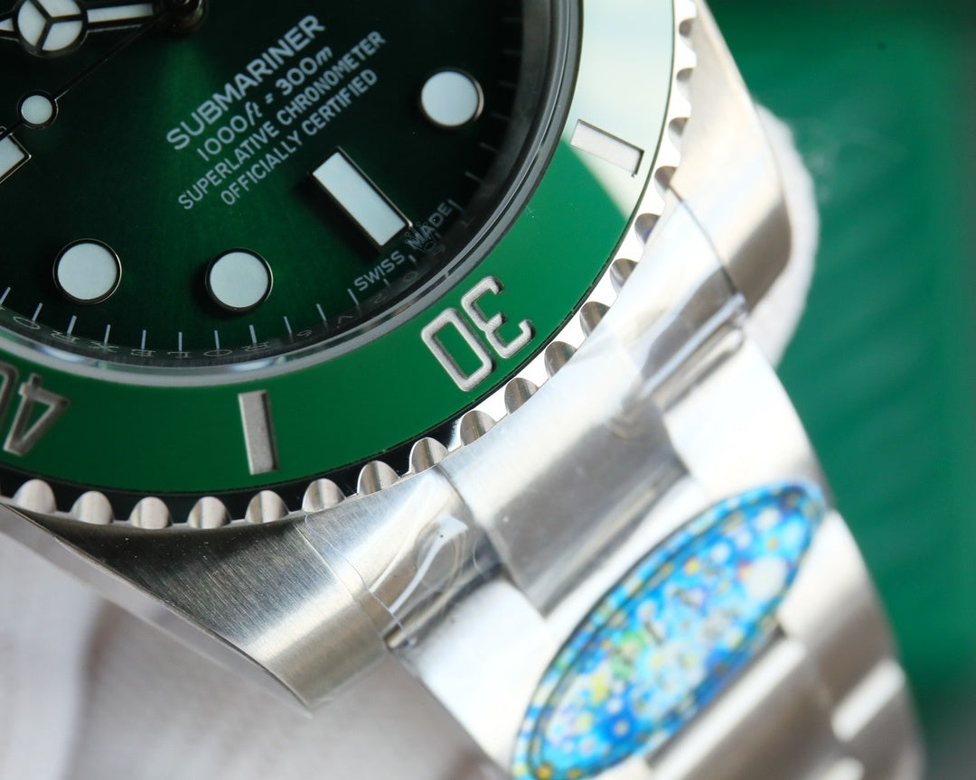 Rolex Submariner stainless steel bezel and green dial with minute markers close-up