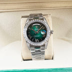 Rolex watch front view with green dial and stainless steel bracelet