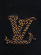 Black crewneck T-shirt with small embroidered gold crest motif