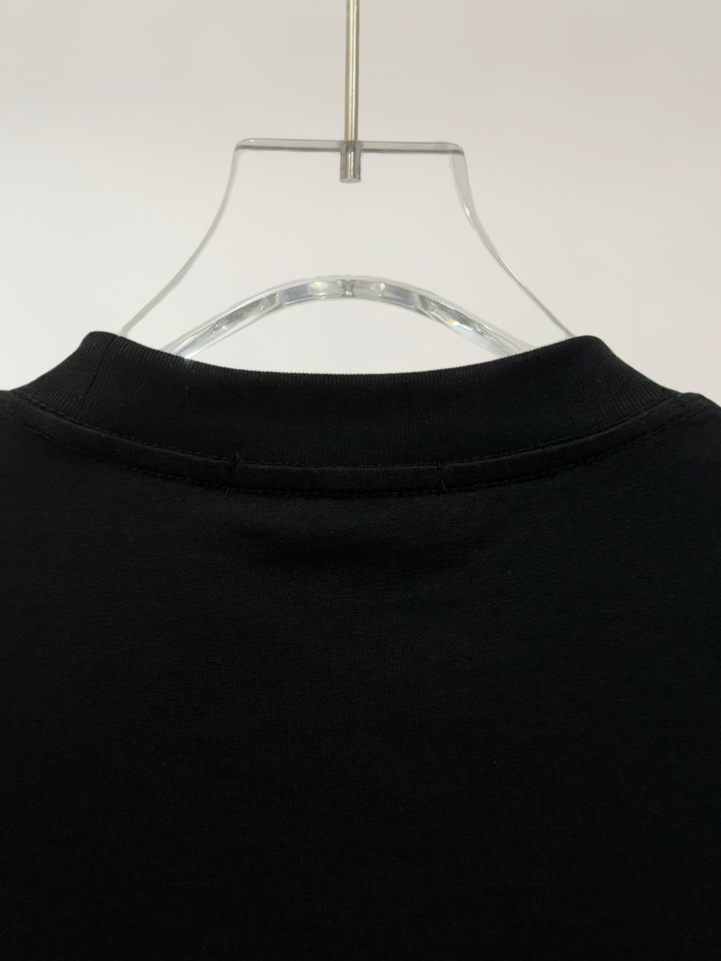 Black crewneck T-shirt neckline with ribbed collar