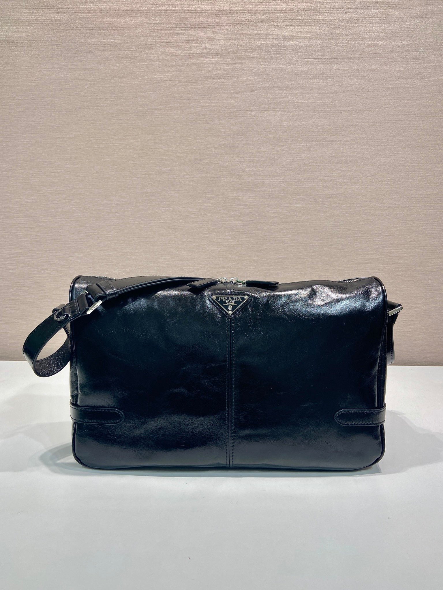 Prada dark navy leather shoulder bag with front flap and crossbody strap