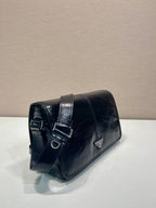 Dark leather flap shoulder bag with buckle strap detail and triangle logo
